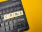 Black keyboard and toys word with the word CRMS on yellow background.