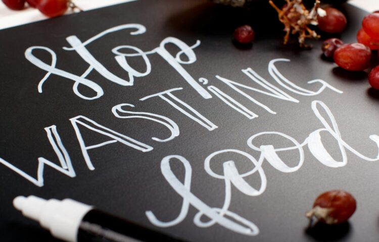 Chalkboard with Stop wasting food lettering