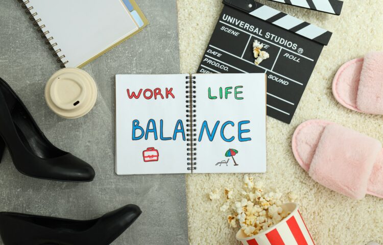 Concept of work-life balance, writing in notebook.