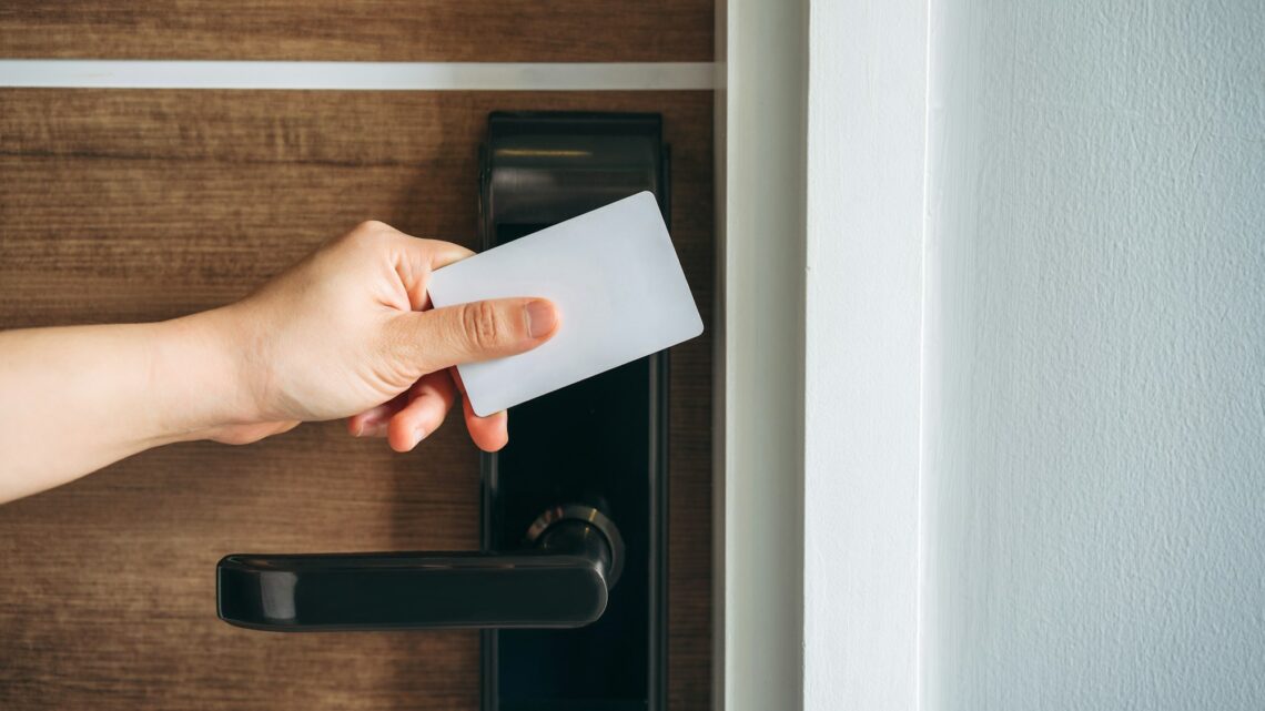 Electronic card key for open door in hotel. Smart card key to lock and unlock door.