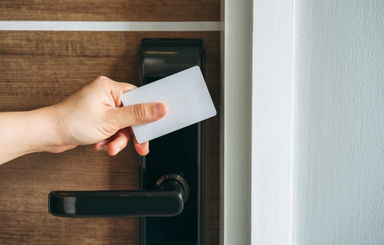 Electronic card key for open door in hotel. Smart card key to lock and unlock door.