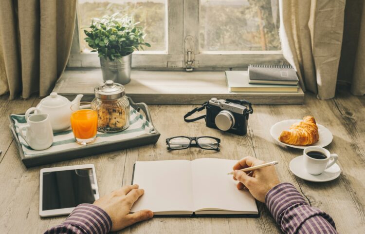 Man writing a journal