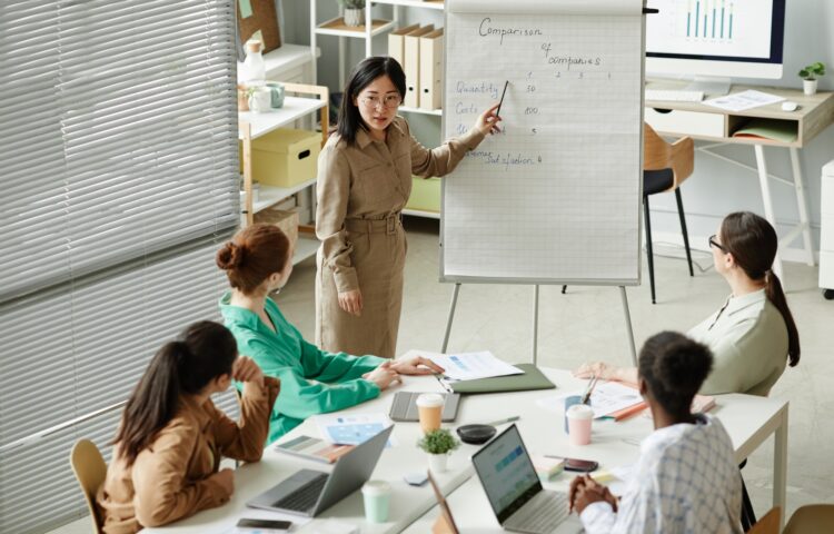 Businesswoman presenting report at business training