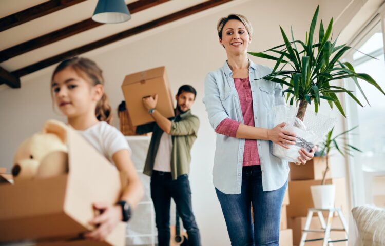 Below view of a family moving into new home.