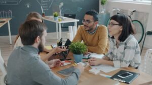 Diverse team collaborating around a table in an office