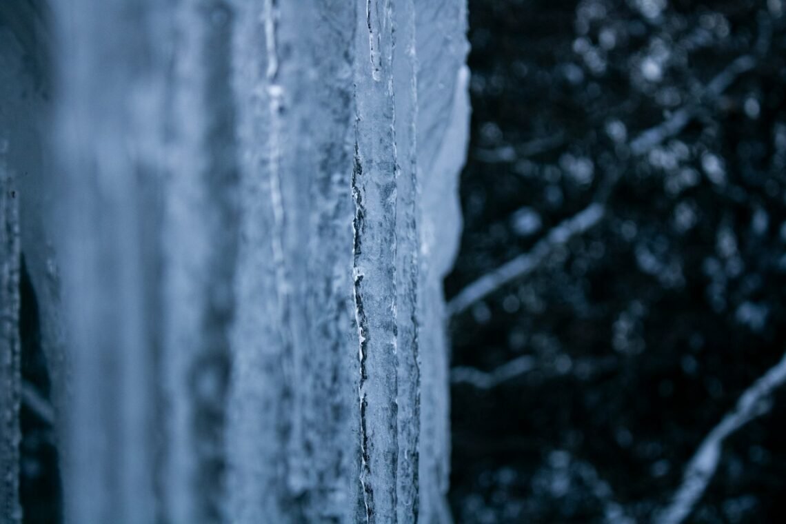Icicles hanging from a window in winter