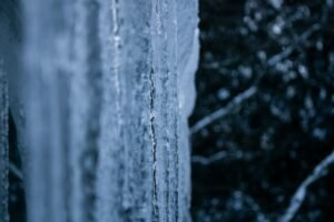 Icicles hanging from a window in winter