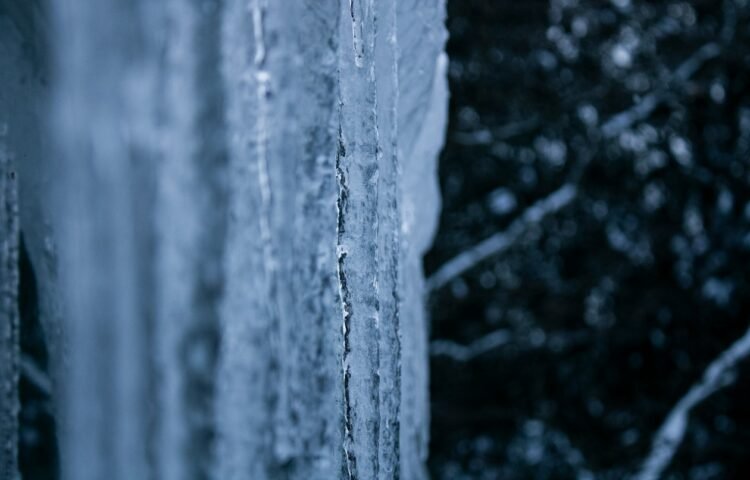 Icicles hanging from a window in winter