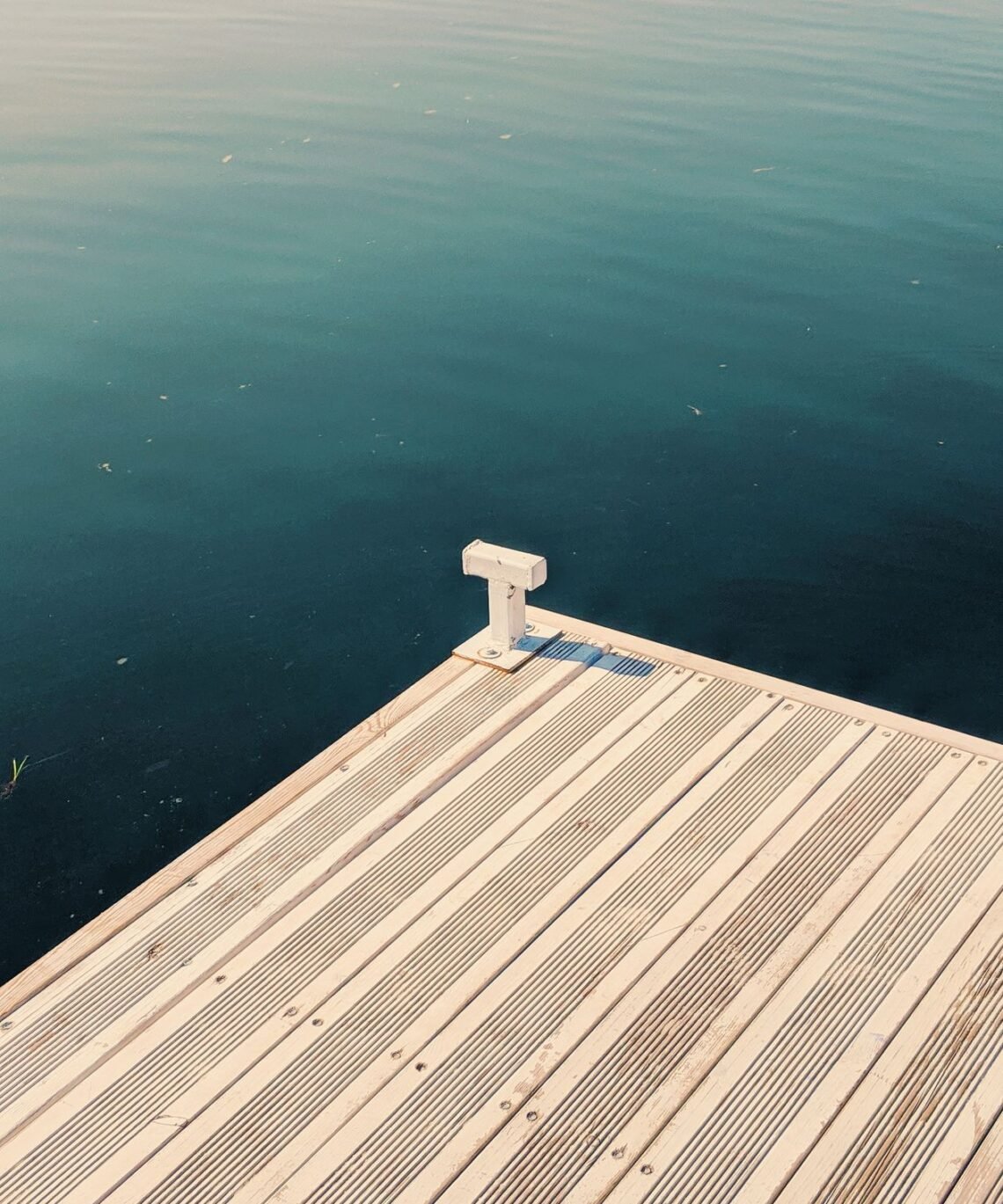 Wooden dock beside calm coastal water