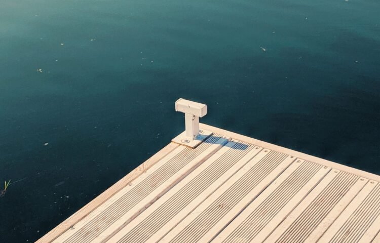 Wooden dock beside calm coastal water